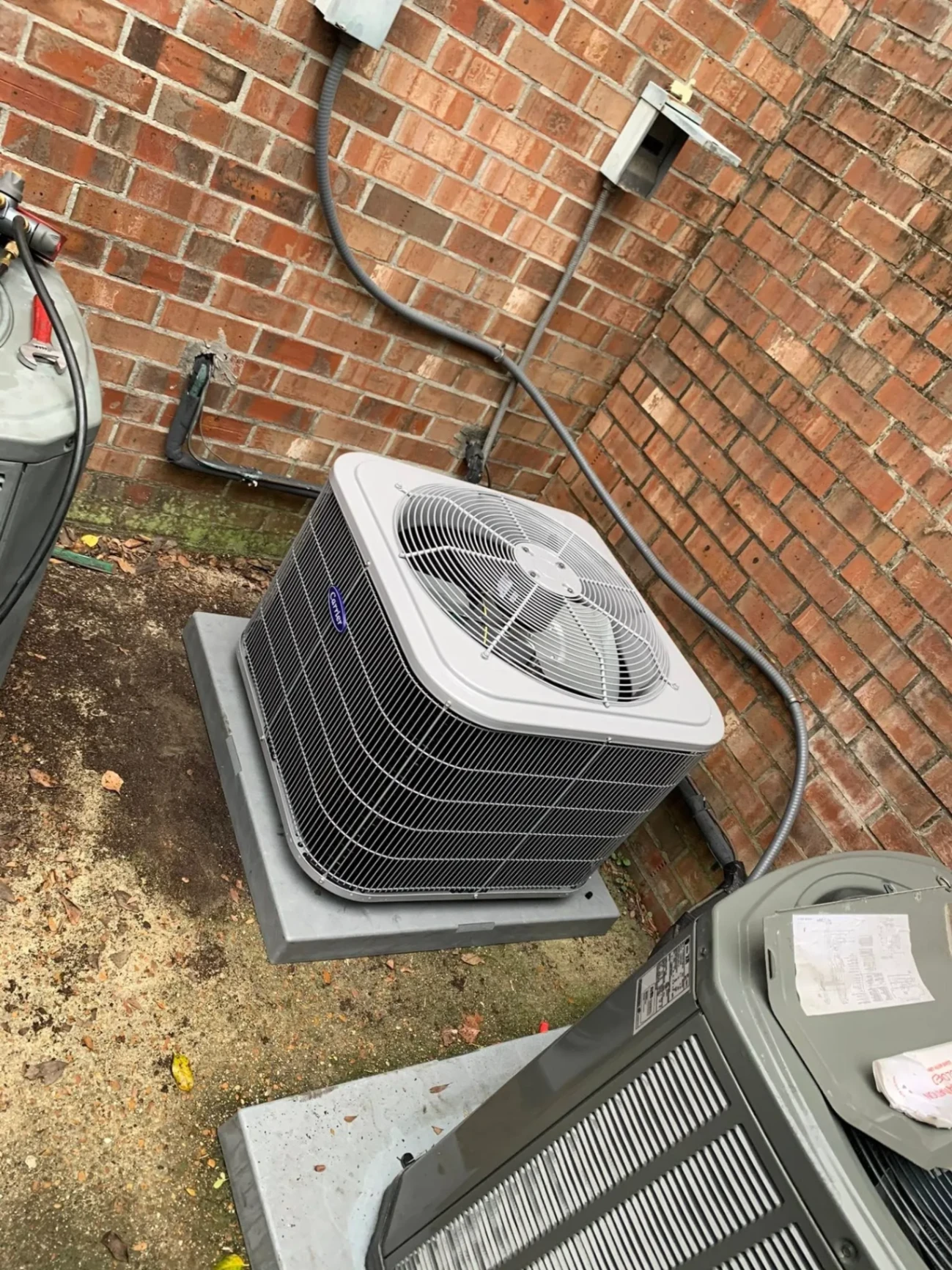 Carrier AC outdoor unit serviced by TMAC Heating & Cooling
